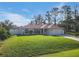 Single-story house with a spacious yard and attached garage at 2970 Cascabel Ter, North Port, FL 34286