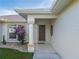 Inviting front entrance with a brown door and columned entryway at 2970 Cascabel Ter, North Port, FL 34286