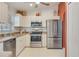 Modern kitchen with stainless steel appliances and light-colored cabinetry at 2970 Cascabel Ter, North Port, FL 34286