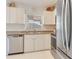 Modern kitchen with stainless steel appliances and light-colored cabinetry at 2970 Cascabel Ter, North Port, FL 34286