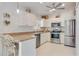 Modern kitchen with stainless steel appliances and light-colored cabinetry at 2970 Cascabel Ter, North Port, FL 34286