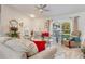 Relaxing living room featuring comfortable seating and a large window at 2970 Cascabel Ter, North Port, FL 34286