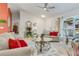 Bright living room features comfy seating, a coffee table, and large windows at 2970 Cascabel Ter, North Port, FL 34286