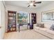 Home office with sofa, built-in bookshelves, and a desk at 2970 Cascabel Ter, North Port, FL 34286