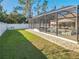 Side yard view of a screened pool and patio area at 2970 Cascabel Ter, North Port, FL 34286