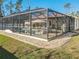 Screened pool and patio area with lounge chairs at 2970 Cascabel Ter, North Port, FL 34286