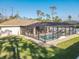 Relaxing screened pool area with patio furniture at 2970 Cascabel Ter, North Port, FL 34286