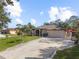 Property showing house, driveway, and surrounding landscape at 3008 Yeadon Ter, North Port, FL 34286