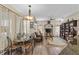 Living room with hardwood floors, seating area, and dining nook at 3008 Yeadon Ter, North Port, FL 34286