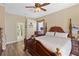 Spacious main bedroom with hardwood floors and access to the bathroom at 3008 Yeadon Ter, North Port, FL 34286