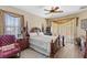 Large main bedroom with a king-size bed and an ensuite bathroom at 3008 Yeadon Ter, North Port, FL 34286