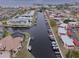 Aerial view of waterfront community with boat docks and canal at 311 Garvin St # 411B, Punta Gorda, FL 33950