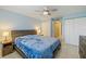 King-size bed in main bedroom with double closets and bathroom access at 311 Garvin St # 411B, Punta Gorda, FL 33950