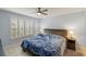 Spacious bedroom with large window, ceiling fan, and wooden dresser at 311 Garvin St # 411B, Punta Gorda, FL 33950