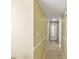 Light and bright hallway with tile flooring and neutral walls at 311 Garvin St # 411B, Punta Gorda, FL 33950