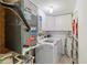 Bright laundry room with washer, dryer, and ample storage at 311 Garvin St # 411B, Punta Gorda, FL 33950