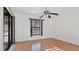 Light and airy bedroom with wood flooring and sliding glass doors at 3128 Ponce De Leon Blvd, North Port, FL 34291