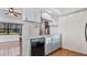 Kitchen features light-colored cabinets and black appliances at 3128 Ponce De Leon Blvd, North Port, FL 34291