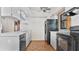 Galley-style kitchen with black appliances and light cabinets at 3128 Ponce De Leon Blvd, North Port, FL 34291