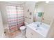 Bathroom with shower/tub combo and striped curtain at 317 Monaco Dr # 7, Punta Gorda, FL 33950