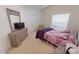 Bedroom with a full-size bed and dresser at 317 Monaco Dr # 7, Punta Gorda, FL 33950