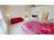 Main bedroom with a king-size bed and a red couch at 317 Monaco Dr # 7, Punta Gorda, FL 33950