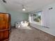 Cozy bedroom with neutral carpeting, large window, and ample closet space at 3341 Briant St, North Port, FL 34287