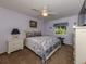 Serene bedroom with light walls, carpeted floors, and a ceiling fan at 3341 Briant St, North Port, FL 34287