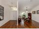 Bright dining room with hardwood floors and built-in hutch at 3341 Briant St, North Port, FL 34287