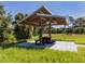 Covered picnic table in a grassy area with shade at 3341 Briant St, North Port, FL 34287