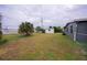 Large backyard with grassy area and storage shed at 350 Duxbury Ave, Port Charlotte, FL 33952