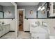 Bathroom with white tile, marble vanity, and a vessel sink at 350 Duxbury Ave, Port Charlotte, FL 33952