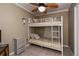 Bedroom with a bunk bed, ceiling fan, and dresser at 350 Duxbury Ave, Port Charlotte, FL 33952