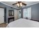 Bedroom with double bed, gray walls, and ceiling fan at 350 Duxbury Ave, Port Charlotte, FL 33952