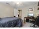 Charming bedroom with a full bed and built-in desk, perfect for working from home at 3953 Vehlin St, North Port, FL 34286