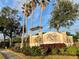 River Club community entrance with signage and lush landscaping at 4269 River Bank Way, Port Charlotte, FL 33980