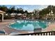 Community swimming pool with lounge chairs and a gazebo at 4269 River Bank Way, Port Charlotte, FL 33980