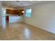 Open dining area with tile floors and kitchen view at 4269 River Bank Way, Port Charlotte, FL 33980