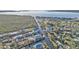 Aerial view of a waterfront neighborhood on a canal and with access to open water at 4297 Nettle Rd, Port Charlotte, FL 33953