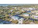 Aerial view of a neighborhood showing homes on canals with docks and lifts and access to open water at 4297 Nettle Rd, Port Charlotte, FL 33953