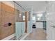 Modern bathroom with a glass-enclosed shower featuring attractive tile work and ample natural light at 4297 Nettle Rd, Port Charlotte, FL 33953