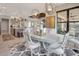 Elegant dining room with oval table and chairs near the kitchen at 5221 Almar Dr, Punta Gorda, FL 33950