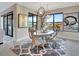 Bright dining room with a round table and chairs, featuring natural light at 5221 Almar Dr, Punta Gorda, FL 33950