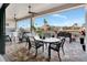 Covered patio with outdoor kitchen, seating area, and water views at 5221 Almar Dr, Punta Gorda, FL 33950