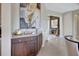 Elegant wet bar with granite countertop and dark wood cabinets at 5221 Almar Dr, Punta Gorda, FL 33950