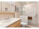 Bathroom with walk-in shower and built-in bench seat at 616 Cherrywood Dr, Englewood, FL 34223