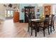 Elegant dining room with hardwood floors, a six-chair table and a view into the living room at 616 Cherrywood Dr, Englewood, FL 34223