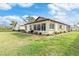 Exterior view of house with landscaping and water view at 616 Cherrywood Dr, Englewood, FL 34223