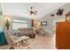 Relaxing living room with comfortable seating, hardwood floors, and plenty of natural light at 616 Cherrywood Dr, Englewood, FL 34223