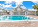 Community pool with patio furniture at 616 Cherrywood Dr, Englewood, FL 34223